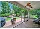 Screened patio featuring brick flooring, a ceiling fan, and views of the landscaped backyard at 964 Knob Creek Ln, Fort Mill, SC 29708