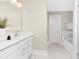 Bathroom featuring double vanity, with a separate soaking tub at 9858 Jack Nicklaus Dr # 897, Lancaster, SC 29720