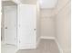 Walk-in closet features neutral carpeting, white walls, and wire shelving providing ample storage space at 9858 Jack Nicklaus Dr # 897, Lancaster, SC 29720