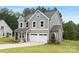 Stylish two-story home with gray siding, a well-maintained lawn, and a two-car garage, offering modern curb appeal at 9858 Jack Nicklaus Dr # 897, Lancaster, SC 29720