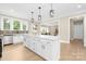 Spacious kitchen with white cabinets, an island, and stainless steel appliances at 9858 Jack Nicklaus Dr # 897, Lancaster, SC 29720