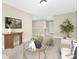 Open living room with a glass coffee table, plant, and a view to the upper level at 9858 Jack Nicklaus Dr # 897, Lancaster, SC 29720