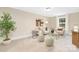 Cozy living room with neutral tones, comfortable seating, and natural light from a window at 9858 Jack Nicklaus Dr # 897, Lancaster, SC 29720