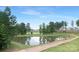 Scenic pond view on the golf course, surrounded by lush greenery and a walking path at 9858 Jack Nicklaus Dr # 897, Lancaster, SC 29720