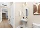 Chic powder room featuring a pedestal sink and elegant finishes at 9858 Jack Nicklaus Dr # 897, Lancaster, SC 29720