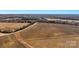 Overhead view of a land parcel with a road winding through fields and bordered by woods, ready for development at 0000 Milling Rd, Rock Hill, SC 29730