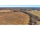 Elevated view of land with fields, mature trees, and road access, offering potential for building or agricultural use at 0000 Milling Rd, Rock Hill, SC 29730
