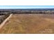 High aerial view of open land with a road nearby and tree coverage, perfect for residential or agricultural development at 0000 Milling Rd, Rock Hill, SC 29730