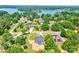 An aerial perspective of a lovely residence surrounded by verdant trees with a lake nearby at 102 Starmount Dr, Kings Mountain, NC 28086