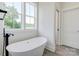 Modern bathroom with a soaking tub and black faucet at 102 Starmount Dr, Kings Mountain, NC 28086