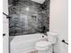 Modern bathroom features a sleek subway tile backsplash in the shower/tub at 102 Starmount Dr, Kings Mountain, NC 28086