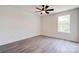 This bedroom features neutral walls, wood-look floors and a modern ceiling fan at 102 Starmount Dr, Kings Mountain, NC 28086