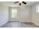 Bedroom featuring laminate floors, a ceiling fan, and bright window views at 102 Starmount Dr, Kings Mountain, NC 28086