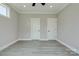 Neutral bedroom with ceiling fan, two doors, gray walls and laminate flooring at 102 Starmount Dr, Kings Mountain, NC 28086