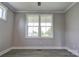 Modern bedroom features large window with natural light and hardwood floors at 102 Starmount Dr, Kings Mountain, NC 28086