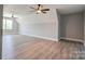Large bonus room with two ceiling fans, dormer window, and laminate floors at 102 Starmount Dr, Kings Mountain, NC 28086