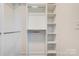 Custom closet features multiple shelves and chrome hanging rods at 102 Starmount Dr, Kings Mountain, NC 28086