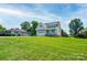 Inviting exterior view of home with an attached garage and verdant front lawn at 102 Starmount Dr, Kings Mountain, NC 28086