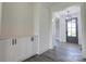 Entranceway with built-in cabinetry and sleek gray flooring leading to the front door at 102 Starmount Dr, Kings Mountain, NC 28086