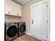Convenient laundry room equipped with modern appliances and white shaker cabinets at 102 Starmount Dr, Kings Mountain, NC 28086