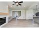 Spacious living room with a fireplace, modern flooring, and an open floor plan at 102 Starmount Dr, Kings Mountain, NC 28086
