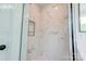 New shower with seamless glass and white marble tile at 102 Starmount Dr, Kings Mountain, NC 28086