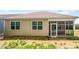 Back of the house featuring a screened porch and view of the backyard at 103 Margo Ln, Statesville, NC 28677