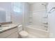 Bright bathroom features a shower-tub combo and a granite-topped vanity at 103 Margo Ln, Statesville, NC 28677