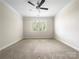 Clean, carpeted bedroom with a large window providing ample natural light at 103 Margo Ln, Statesville, NC 28677