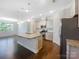 Modern kitchen with granite countertops, stainless steel appliances, and an island at 103 Margo Ln, Statesville, NC 28677