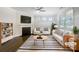 Bright, staged living room with fireplace, hardwood floors, and modern decor at 103 Margo Ln, Statesville, NC 28677