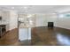 Open-concept living space boasts modern kitchen and cozy fireplace at 103 Margo Ln, Statesville, NC 28677