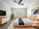 Staged main bedroom features a ceiling fan, large window, and comfortable furnishings at 103 Margo Ln, Statesville, NC 28677