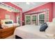 Cozy bedroom featuring a large window, a full-size bed, and a mirrored closet for ample storage space at 111 Trails End Ln, New London, NC 28127