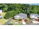 Inviting exterior of home with beautiful landscaping and a screened-in porch for relaxing outdoor enjoyment at 111 Trails End Ln, New London, NC 28127