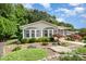 Charming single story home featuring manicured landscaping and a charming screened-in porch at 111 Trails End Ln, New London, NC 28127