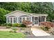 Charming single story home with well-maintained landscaping and inviting screened-in porch at 111 Trails End Ln, New London, NC 28127