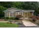 Charming single story home with well-maintained landscaping and inviting screened-in porch at 111 Trails End Ln, New London, NC 28127