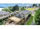 Rear elevated deck with lake view, overlooking a grassy yard with mature trees at 111 Trails End Ln, New London, NC 28127