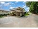 Elevated rear deck over a patio and a paved driveway leading to the house at 111 Trails End Ln, New London, NC 28127