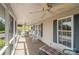 Inviting screened porch with ceiling fans and comfortable seating at 111 Trails End Ln, New London, NC 28127