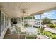 Spacious screened-in porch with ceiling fans, seating, and lake views at 111 Trails End Ln, New London, NC 28127