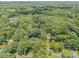 A beautiful house from an aerial view, surrounded by a lot of thick and lush green trees at 1123 Timberlane Dr, Lincolnton, NC 28092