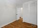 Bedroom featuring wood flooring, a closet and doorway to another room, and natural light at 1123 Timberlane Dr, Lincolnton, NC 28092