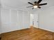 Bedroom with wood flooring, a ceiling fan, natural light, and ample closet space at 1123 Timberlane Dr, Lincolnton, NC 28092