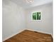 Bedroom featuring wood flooring, natural light, and neutral walls with white trim at 1123 Timberlane Dr, Lincolnton, NC 28092