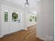 Bright foyer featuring beautiful flooring and a stylish front door with sidelights at 1123 Timberlane Dr, Lincolnton, NC 28092