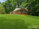 Brick home with attached garage, spacious driveway, and a well-manicured lawn at 1123 Timberlane Dr, Lincolnton, NC 28092