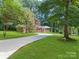 Brick home with attached garage, spacious driveway, and a well-manicured lawn at 1123 Timberlane Dr, Lincolnton, NC 28092