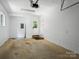 Garage interior with a white door, light colored walls, and an unfinished floor at 1123 Timberlane Dr, Lincolnton, NC 28092